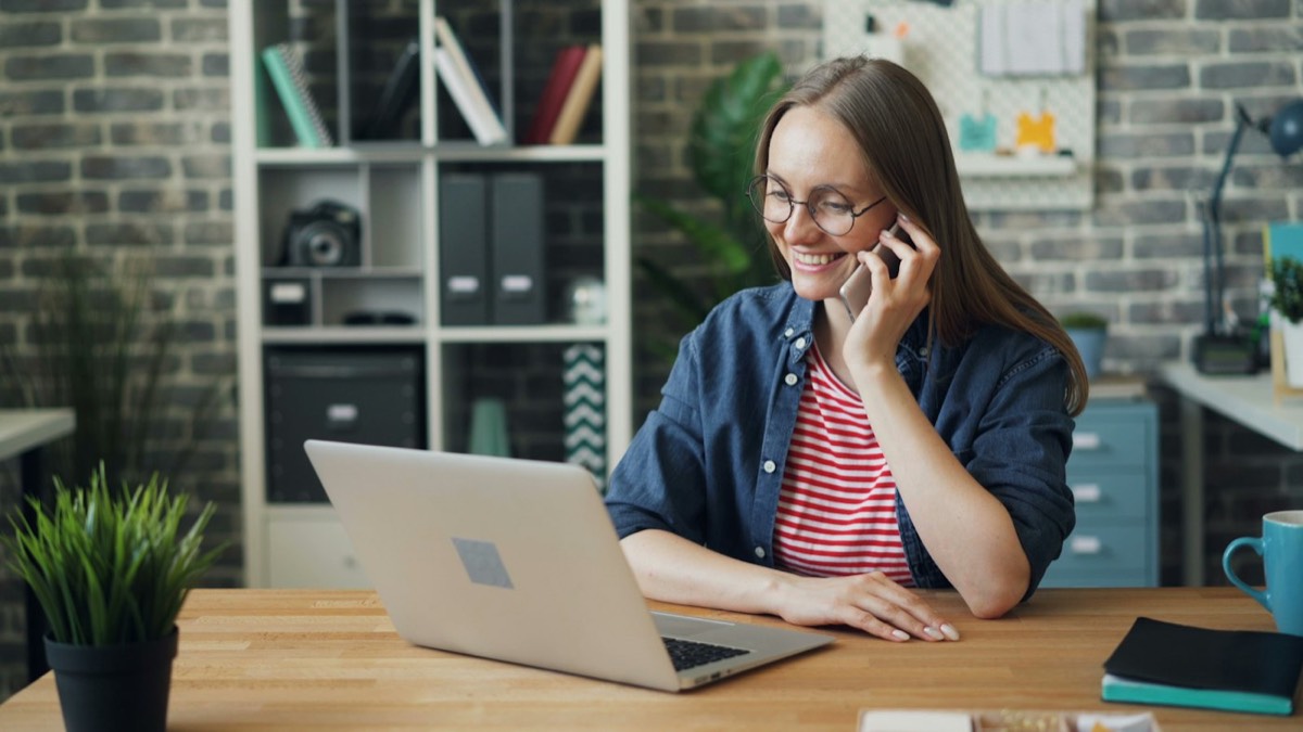 A woman taking an interview call at her laptop